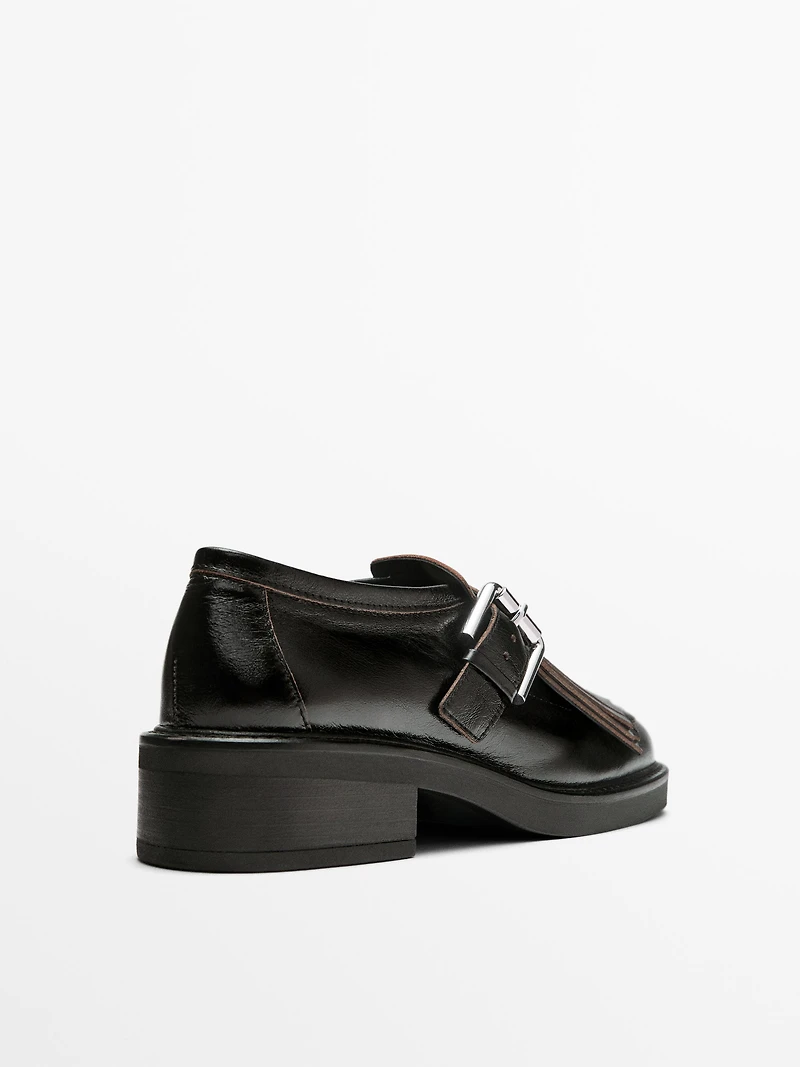 Buckled derby shoes with fringe
