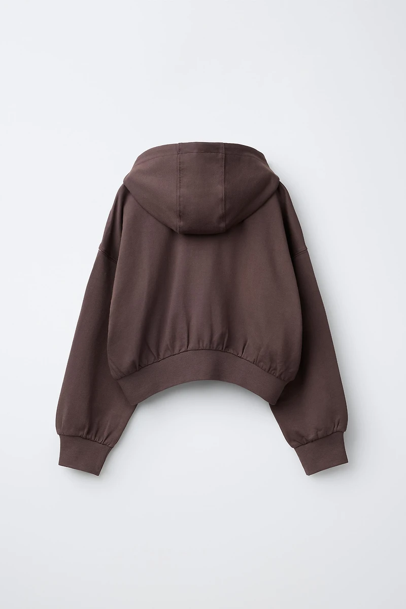 RAISED TEXT HOODIE