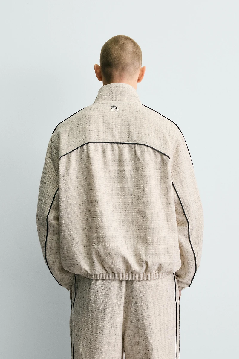 BLOUSON COUPE CARRÉE STRUCTURÉ LISERÉS CONTRASTANTS