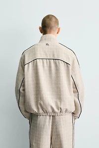BLOUSON COUPE CARRÉE STRUCTURÉ LISERÉS CONTRASTANTS