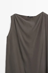 Asymmetric flowing cape top