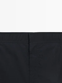 Plain swimming trunks with waist detail