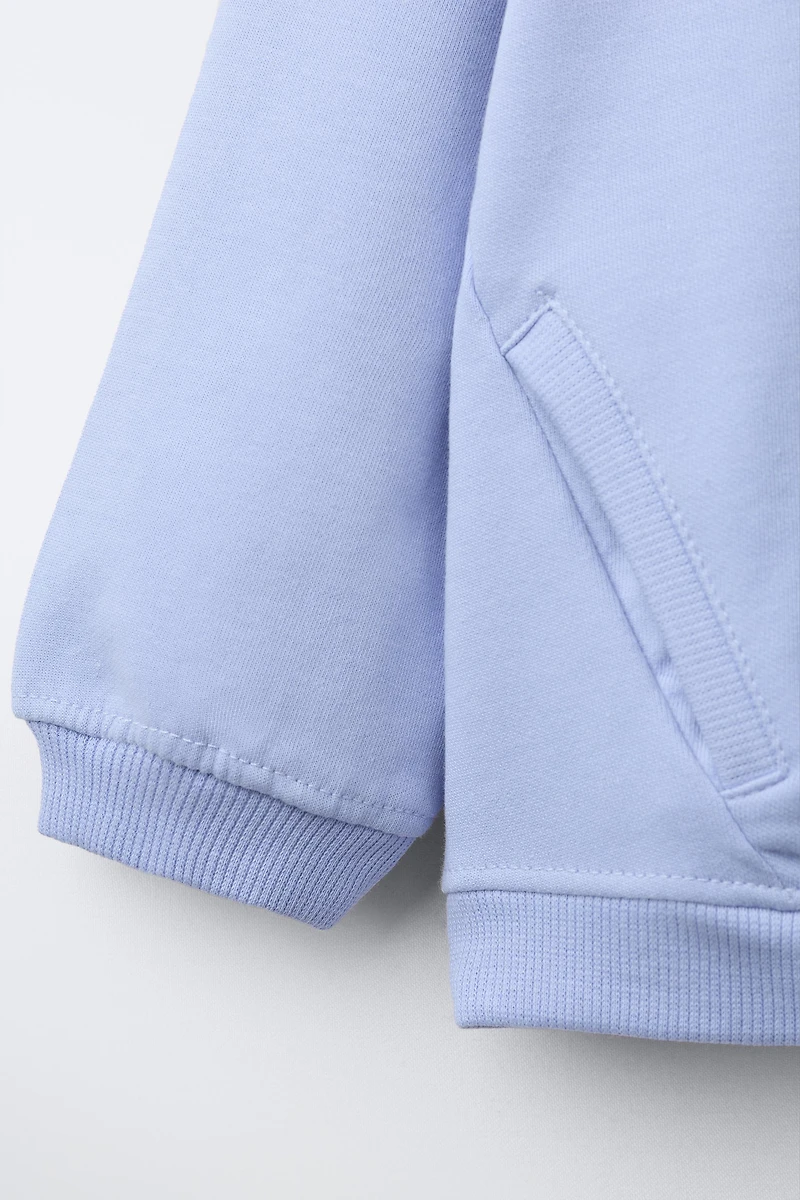INTERLOCK ZIP SWEATSHIRT WITH RAISED TEXT