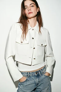 VESTE COURTE À POCHES