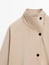 Long cotton trench coat with side fastening