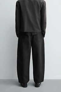 PLEATED BALLOON FIT PANTS