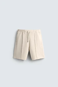 SHORT INTERLOCK ÉTIQUETTE