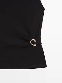 Funnel neck top with brooch detail