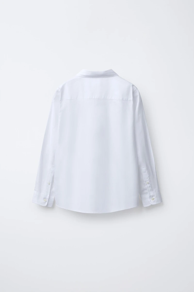 CHEMISE UNIE HABILLÉE