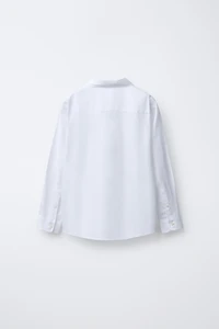 CHEMISE UNIE HABILLÉE