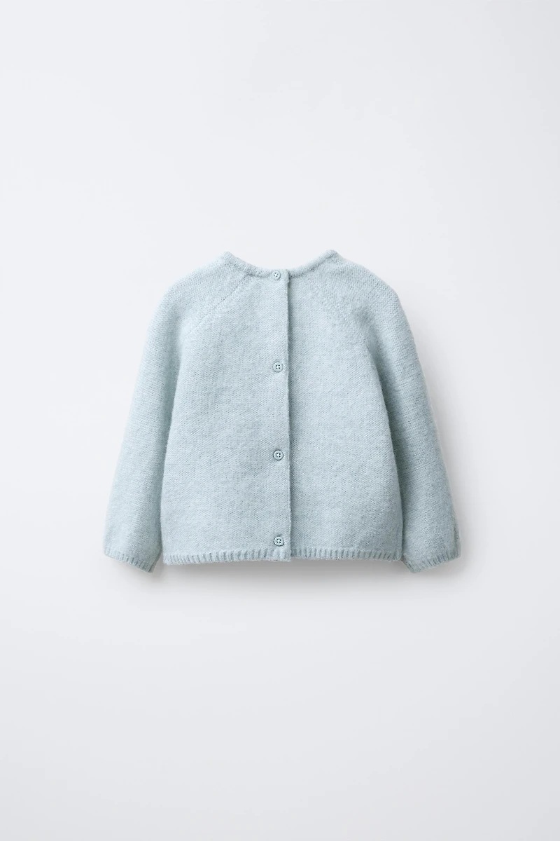 PULL EN MAILLE AVEC FEUILLES