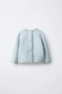 PULL EN MAILLE AVEC FEUILLES