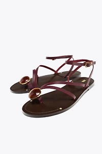 FLAT LEATHER SANDALS WITH DECORATIVE STRAPS