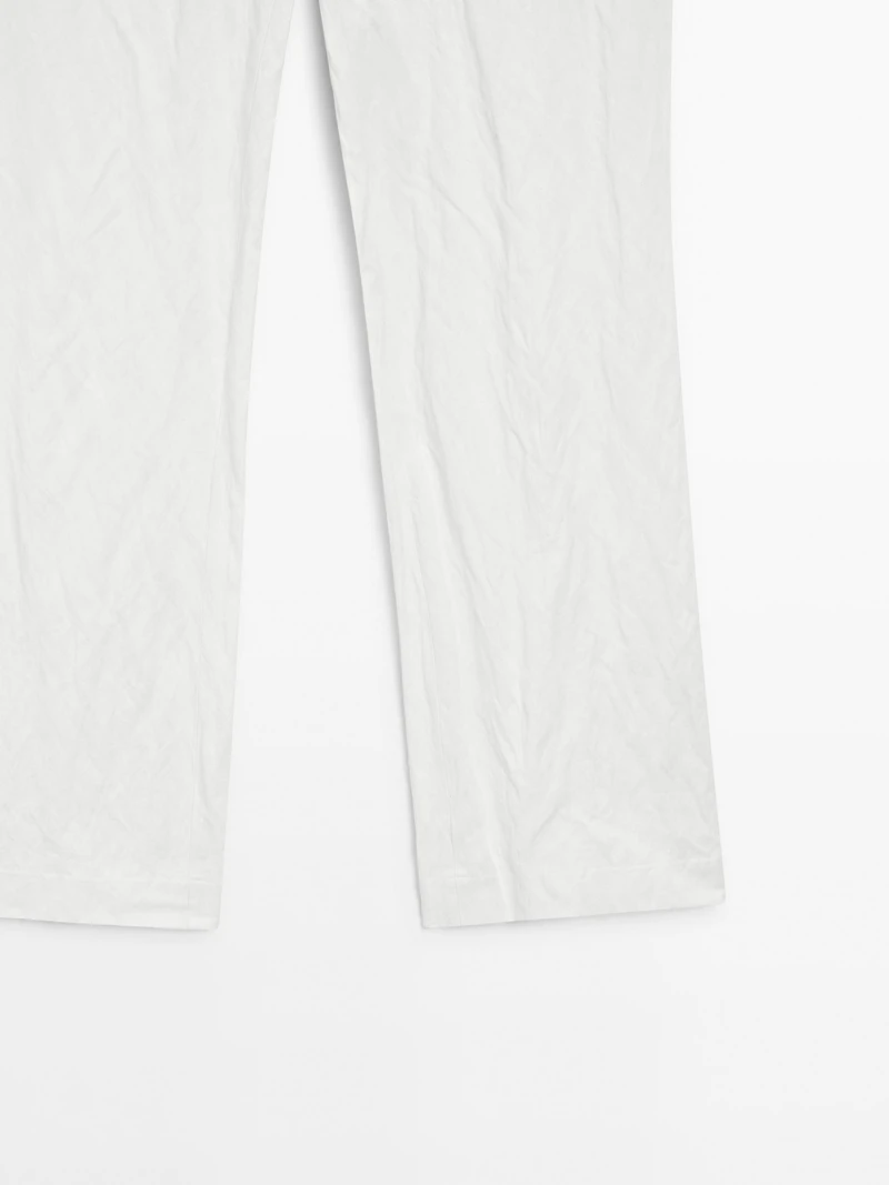 Pantalon slim taille basse avec boucles