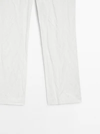 Pantalon slim taille basse avec boucles
