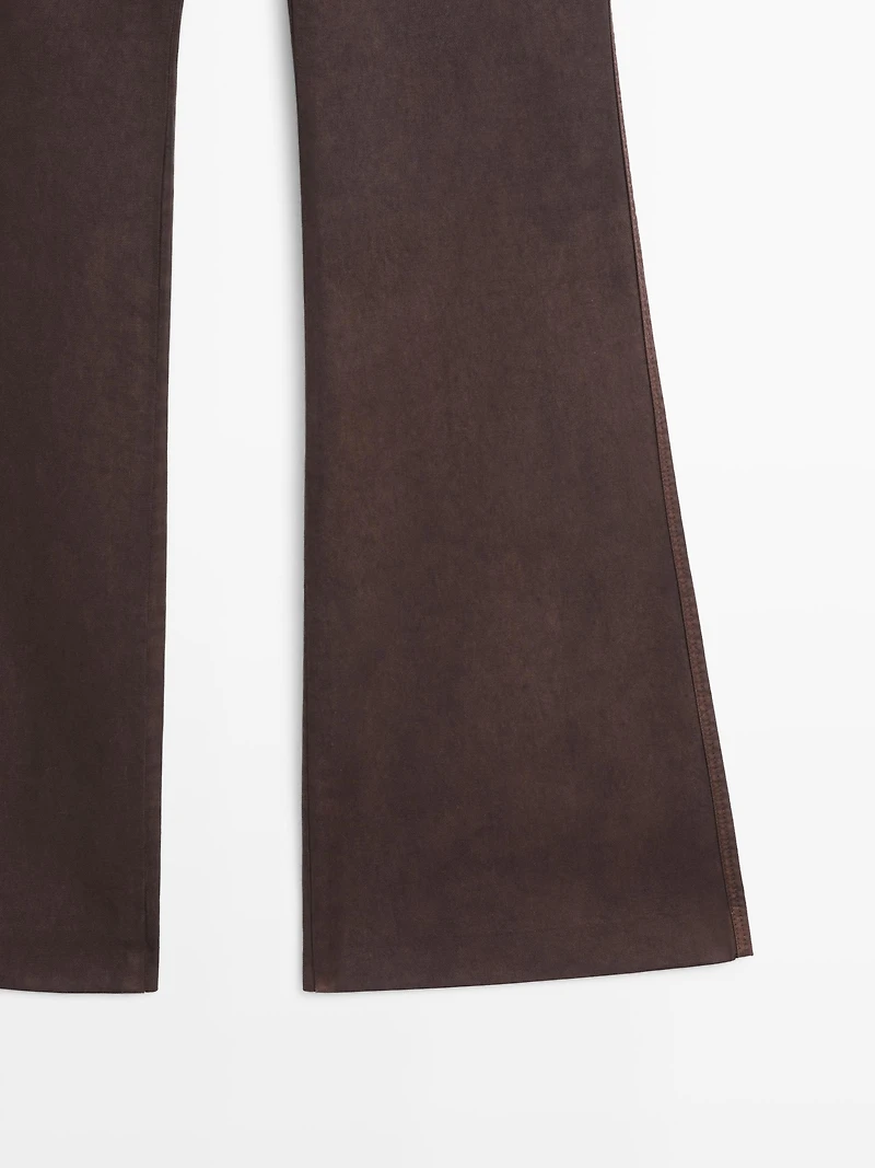 Waxed flare fit trousers