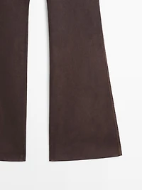 Waxed flare fit trousers