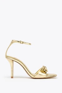 METALLIC EFFECT BOW HEELED SANDALS
