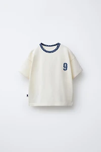 TEXT AND FLORAL PRINT T-SHIRT