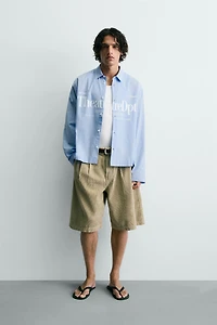 RELAXED FIT PLAID TEXT SHIRT