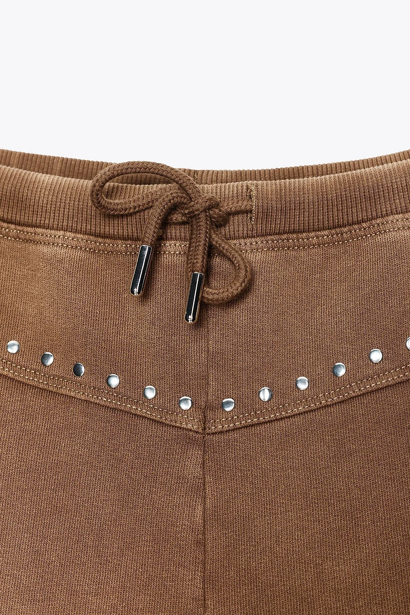 WASHED EFFECT STUDDED SHORTS