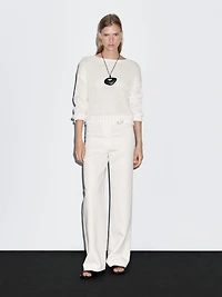 Straight-fit trousers with buckle detail