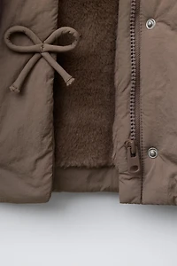 WATER REPELLENT PUFFER COAT WITH BOWS