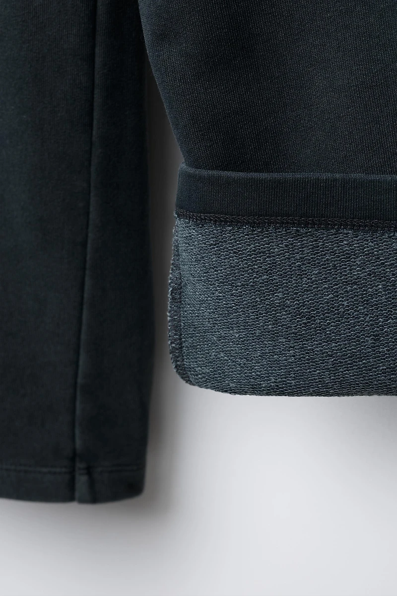 WASHED EFFECT WIDE LEG PANTS WITH STARS AND STUDS