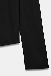 TOP SEMI-TRANSPARENT À MANCHES LONGUES