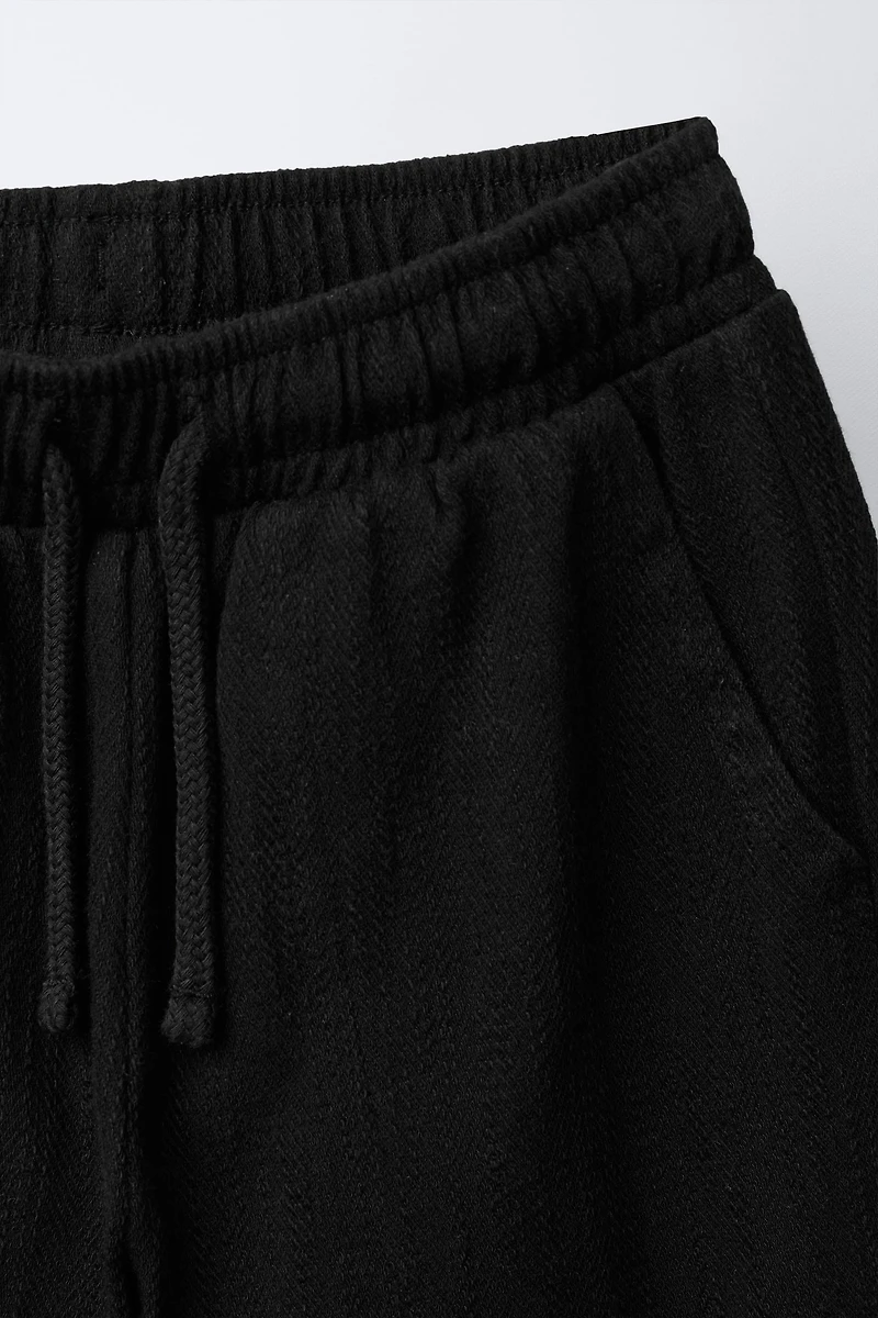 TEXTURED PANTS WITH LABEL