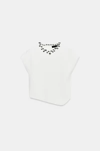 TOP EN MAILLE À BOULES AU COL