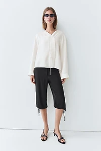 Flowing linen blend blouse with button detail