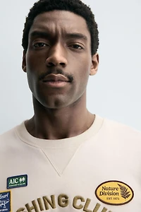 SWEAT À INSCRIPTION BRODÉE