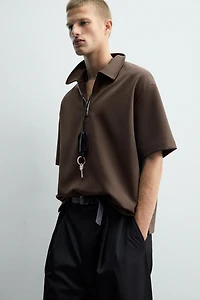 POLO INTERLOCK À ZIP