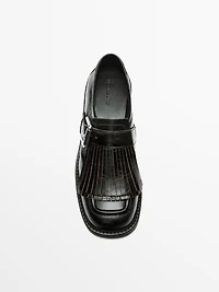 Buckled derby shoes with fringe