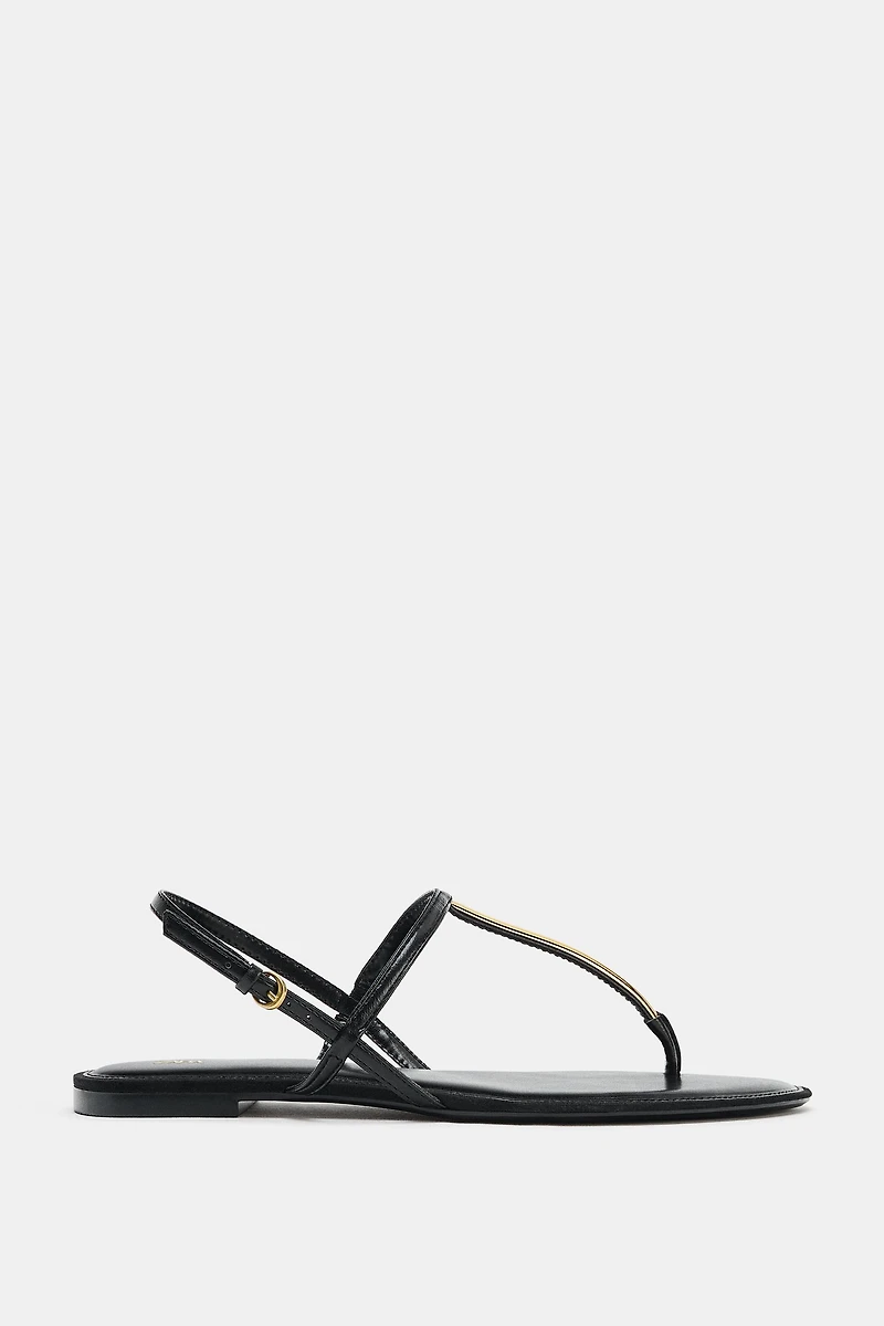 FLAT SANDALS WITH METALLIC APPLIQUE