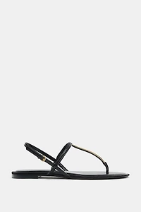 FLAT SANDALS WITH METALLIC APPLIQUE