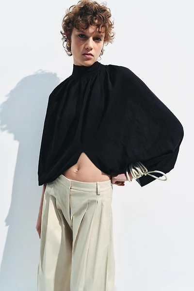 TOP CAPE EN MAILLE FINE