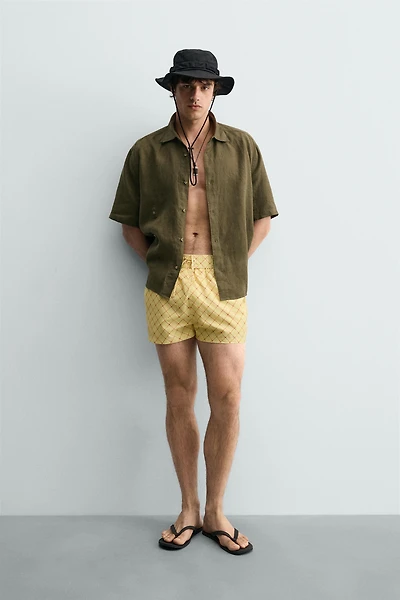 MAILLOT DE BAIN MI-LONG À IMPRIMÉ GÉOMÉTRIQUE DÉLAVÉ