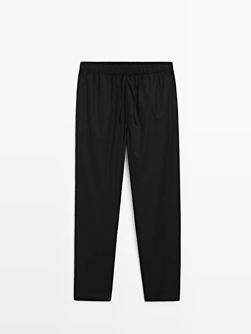 Short sleeve pyjama top and striped trousers
