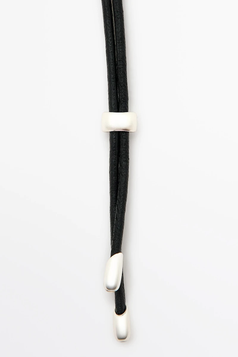 Leather cord necklace with oval pendant