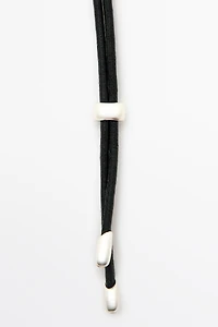 Leather cord necklace with oval pendant