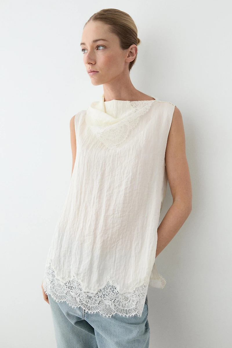 Asymmetric roll neck top with lace detail