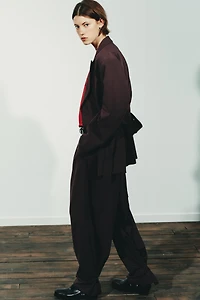 PLEATED PANTS WITH BUTTON HEM