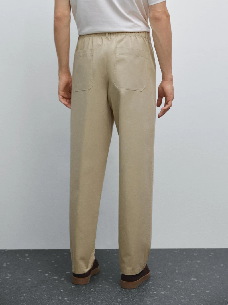 Trousers with patch pocket