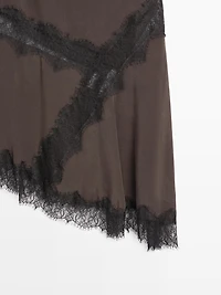 Flowing asymmetric midi skirt with lace detail