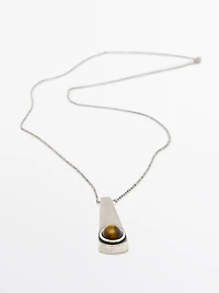 Geometric pendant with stone