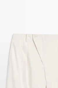 Pantalon à plis et fermeture croisée - STUDIO