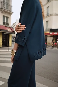 EMBROIDERED EYELET KNIT TOP