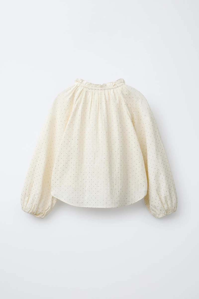 BLOUSE À CLOUS
